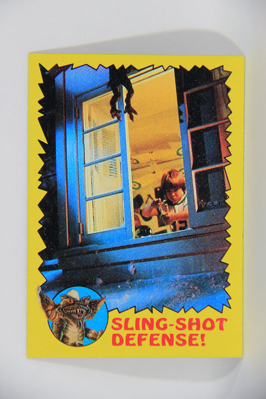 Gremlins 1984 Trading Card #50 Sling-Shot Defense ENG Topps L016476