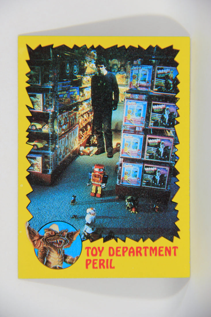 Gremlins 1984 Trading Card #64 Toy Department Peril ENG Topps L016490