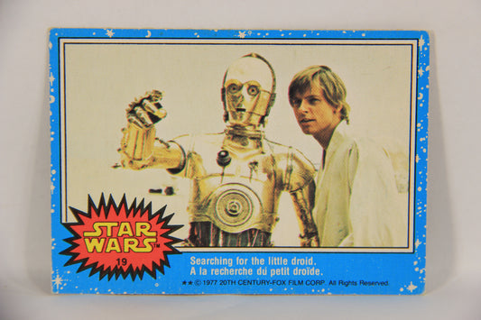 Star Wars 1977 Trading Card #19 Searching For The Little Droid FR-ENG OPC L019200