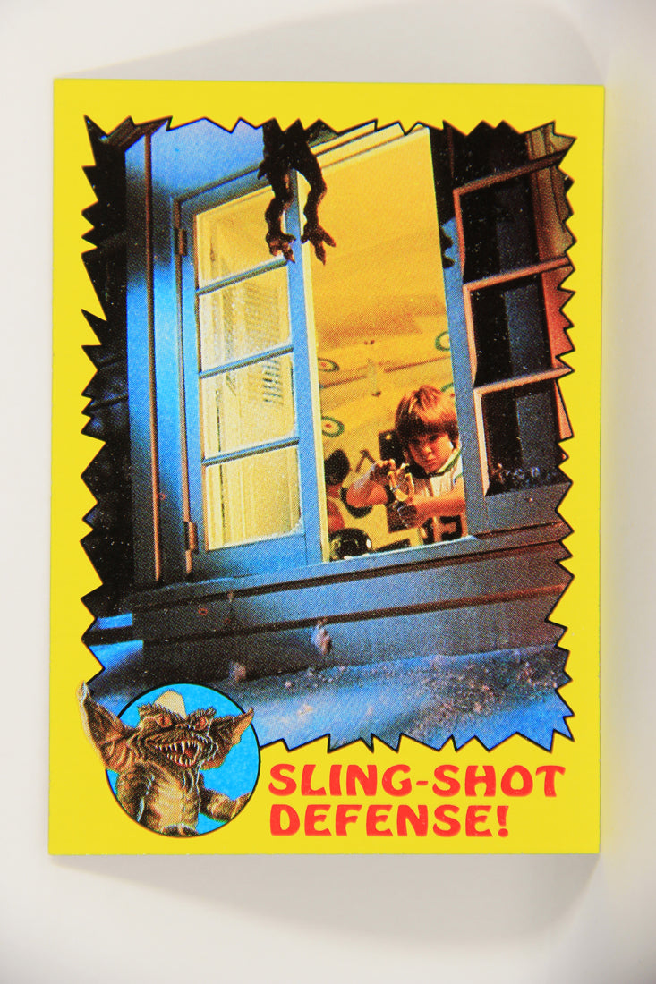 Gremlins 1984 Trading Card #50 Sling-Shot Defense ENG Topps L021165